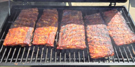 Dominique cooking barbecue 