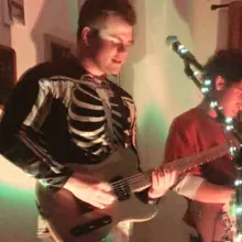 Edward playing guitar on stage