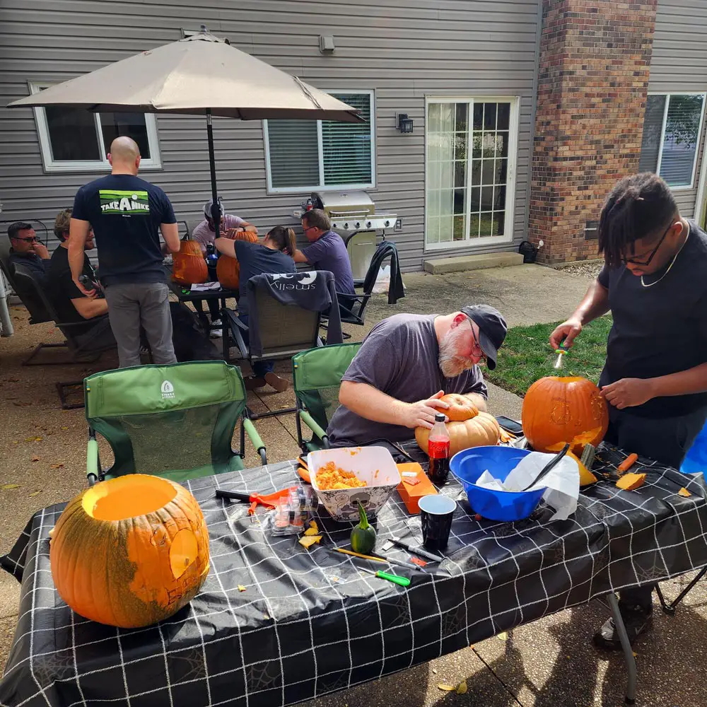 Thoughtprocess Interactive team carving pumpkins for the annual pumpkin carving contest.